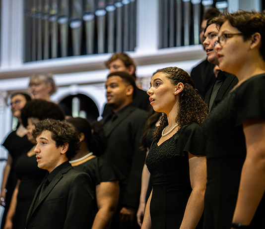 Choir members sing in Lee Chapel