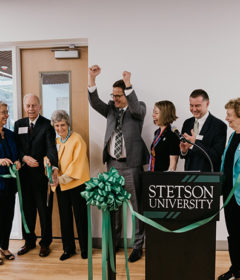Stetson officials react after cutting the ceremonial ribbon