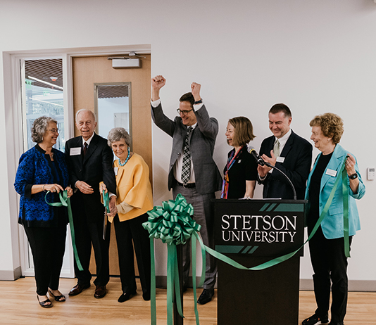 Stetson officials react after cutting the ceremonial ribbon