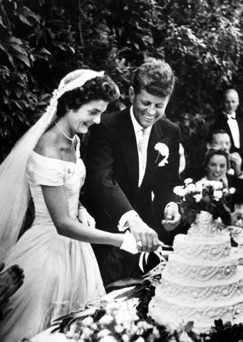 JFK and Jacqueline Lee Bouvier cut the wedding cake. Courtesy JFK Library