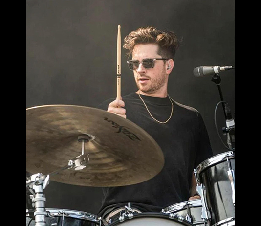 Photo of Justin Tessier playing the drums