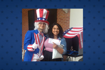 A man dressed as Uncle Sam poses with a voter