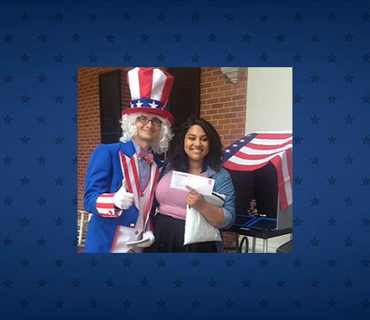 A man dressed as Uncle Sam poses with a voter