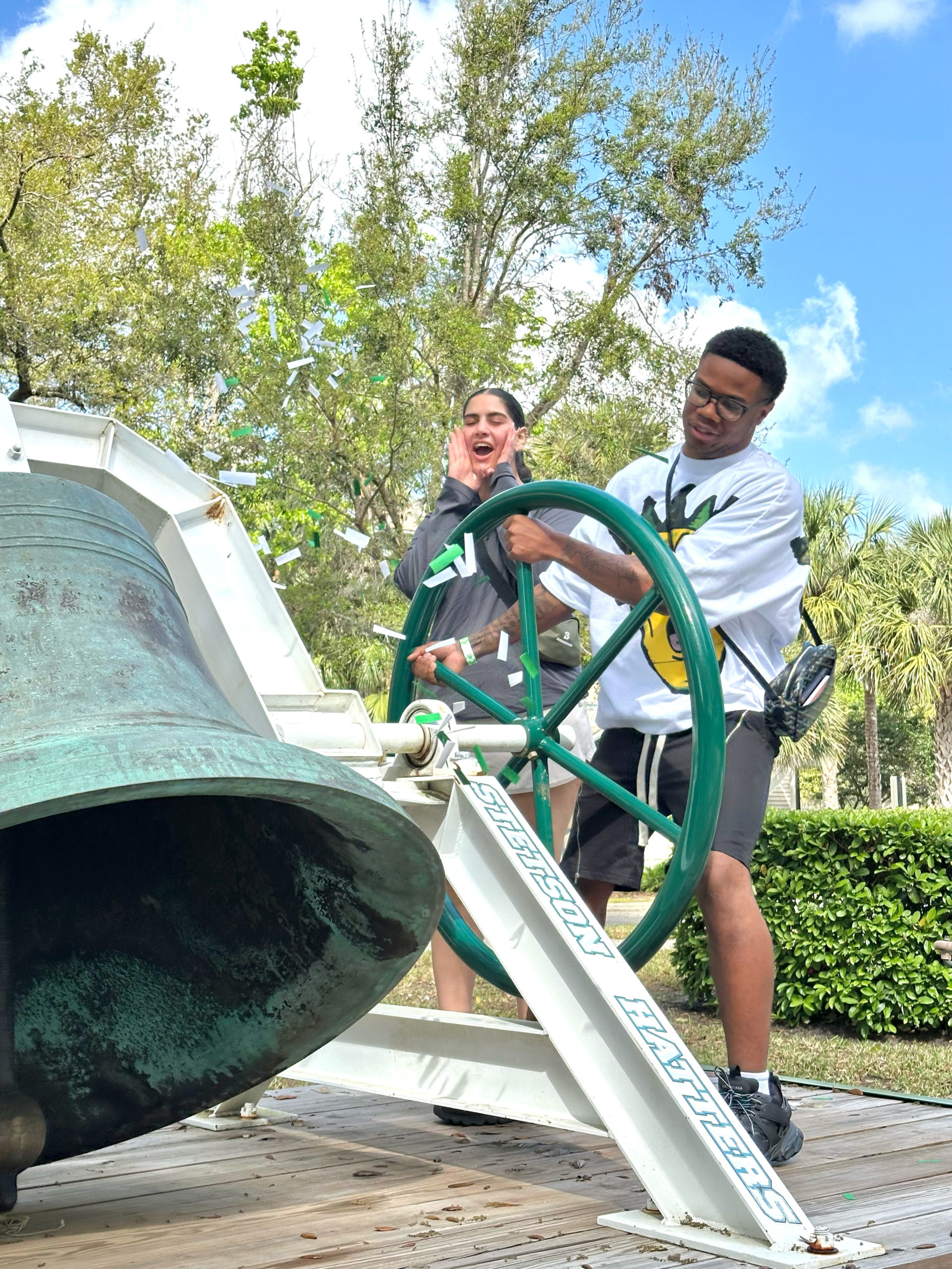 On Hatter Saturday, accepted students ring the Victory Bell