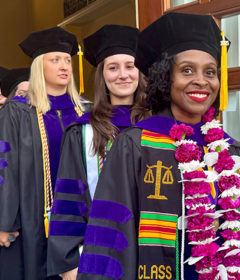 Graduates line up in Commencement regalia