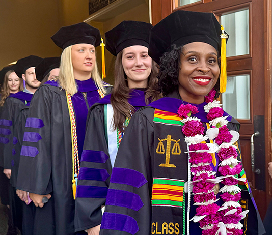 Graduates line up in Commencement regalia