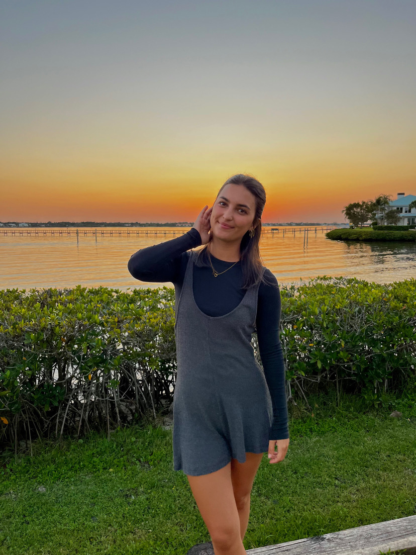 Portrait in front of water