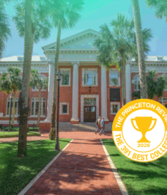 An academic building on campus with a graphic badge that says Best 391 Colleges by the Princeton Review