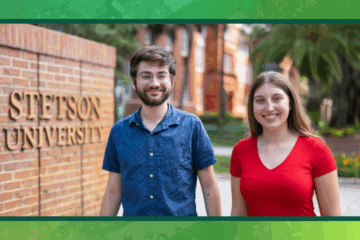 Two students stand in front of the Stetson gates