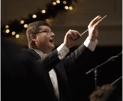 A man conducts a performance