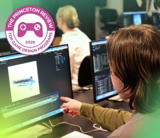 A student points at a computer screen with a graphic imposed that says Top Game Design School 2026