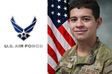 Portrait of a young man in military fatigues with a flag behind him and U.S, Air Force logo beside him.