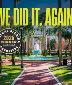 A fountain in a pretty campus scene with the text, We Did It. Again.