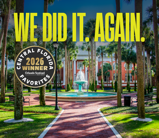 A fountain in a pretty campus scene with the text, We Did It. Again.