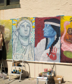 A student painting a mural