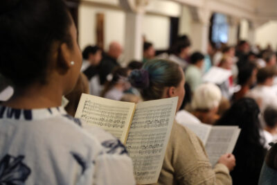 Vocalists performing in the Alumni Choir