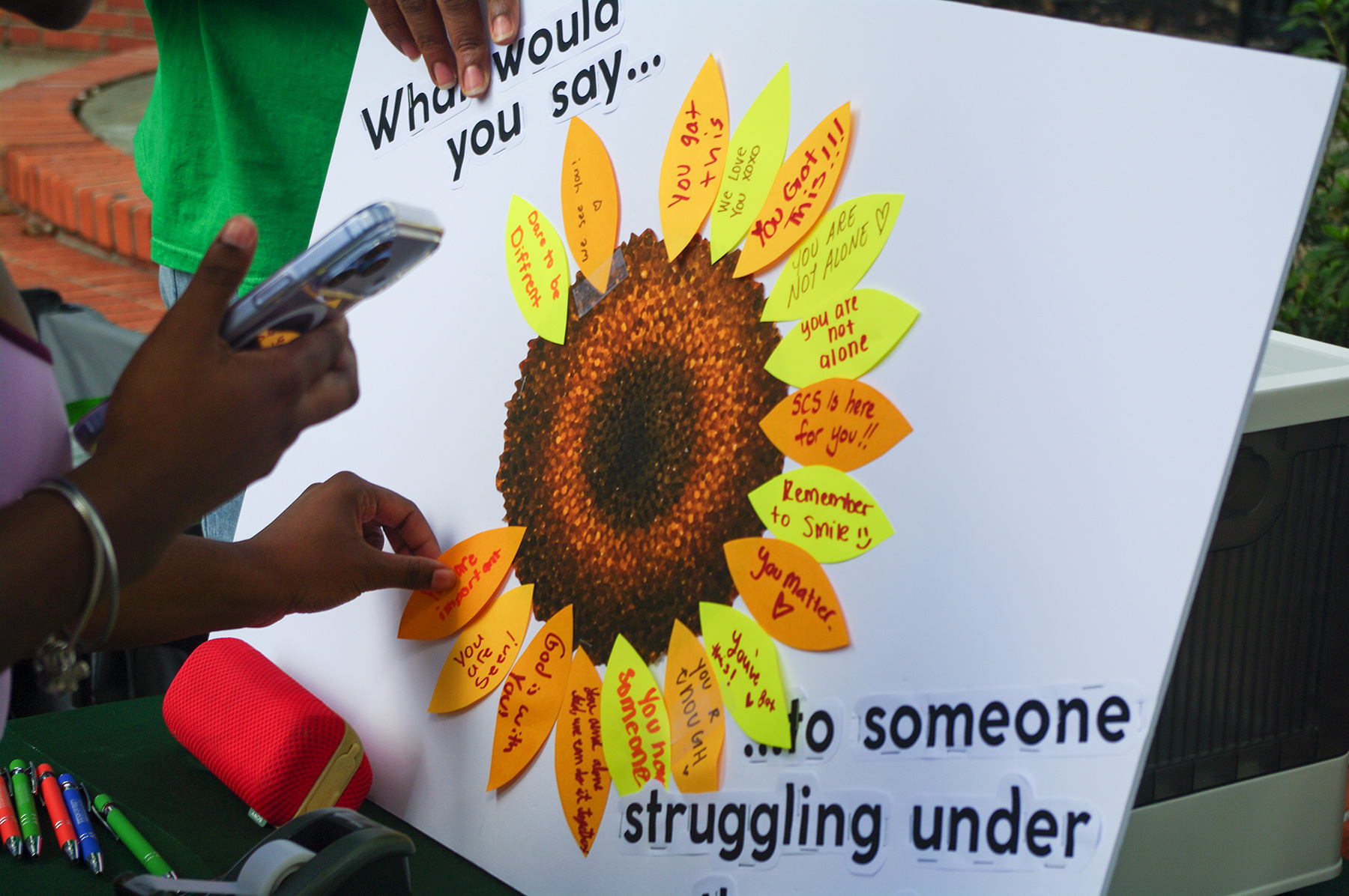 Close-up of board where students could attach yellow or orange petals to create a sunflower