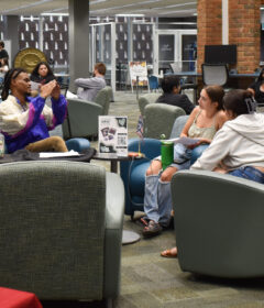Students participating in discussions during Open Book event