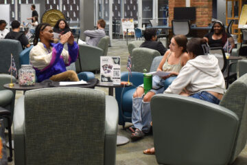 Students participating in discussions during Open Book event