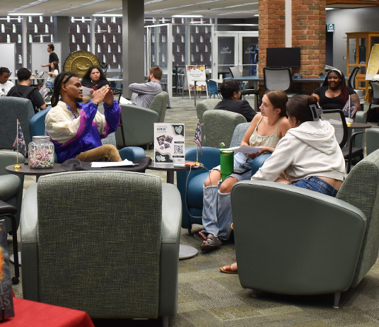 Students participating in discussions during Open Book event